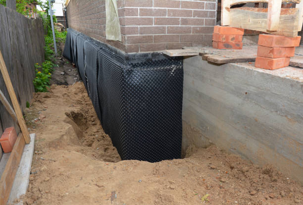 SJ Waterproofing Pros technician performing targeted Waterproofing assessment in Woodland, WA